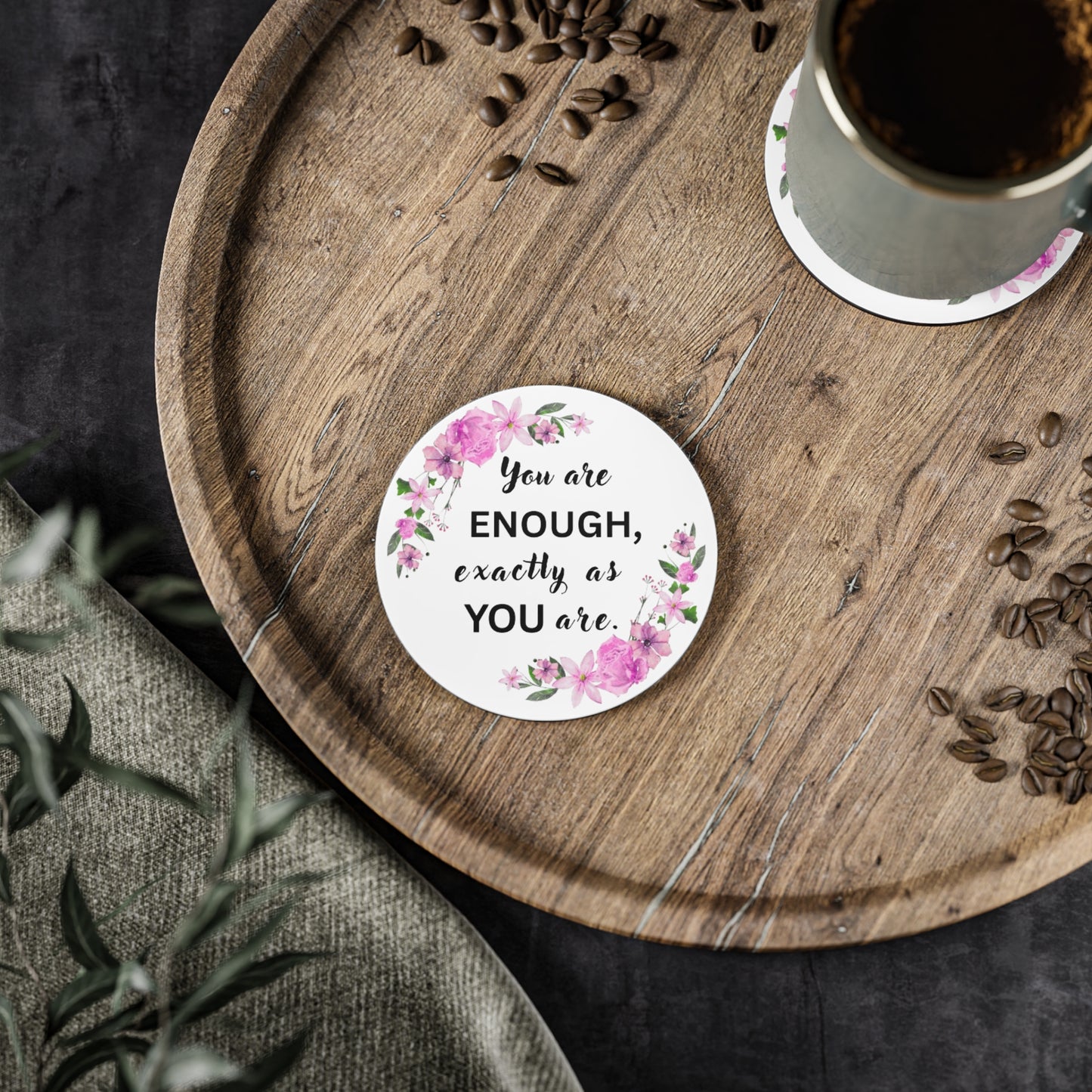 YOU ARE ENOUGH Round motivational sticker with floral design and text on a wooden tray with coffee and seeds.