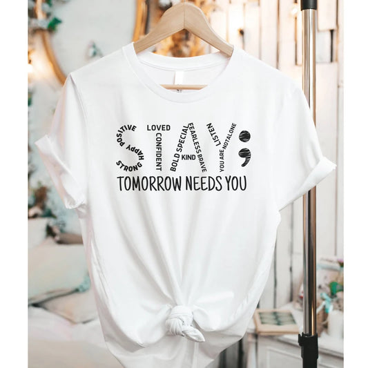White t-shirt with motivational text on a hanger Stay Tomorrow Needs You Women’s Suicide Prevention Awareness T-Shirt