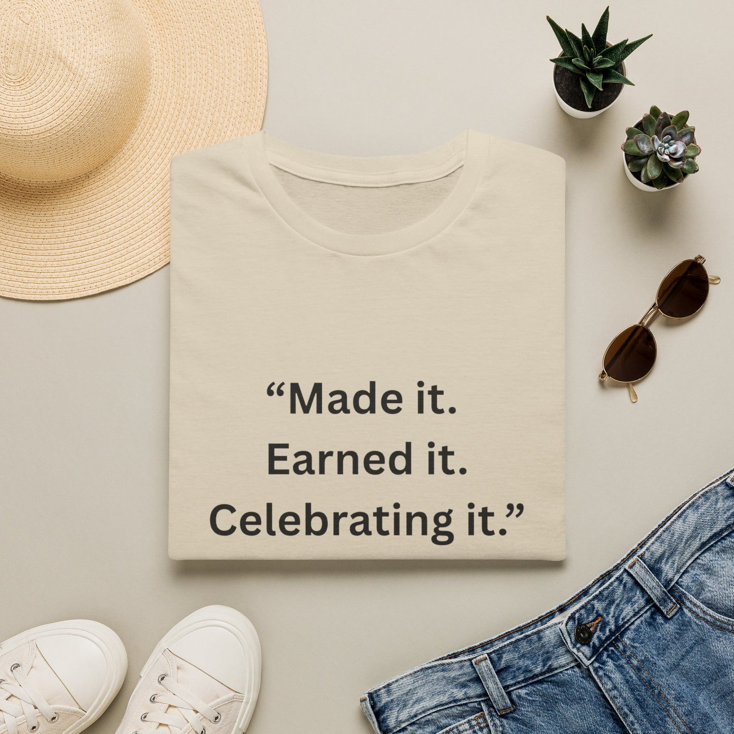 "Made It. Earned It. Celebrating It." — Inspirational Unisex Tee (Black Print)