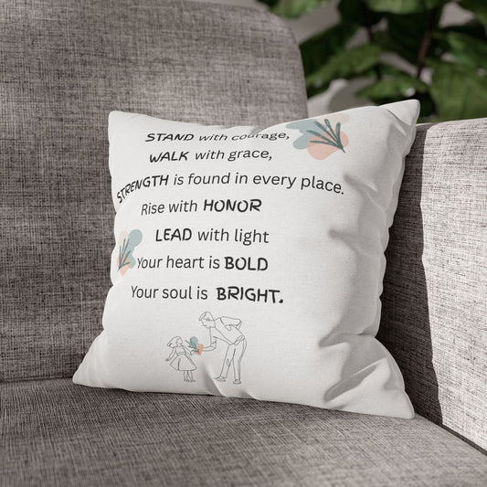 Decorative pillow with motivational quote on a gray couch