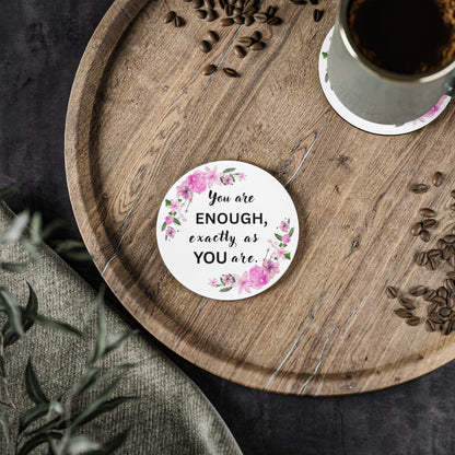 YOU ARE ENOUGH Round motivational sticker with floral design and text on a wooden tray with coffee and seeds.