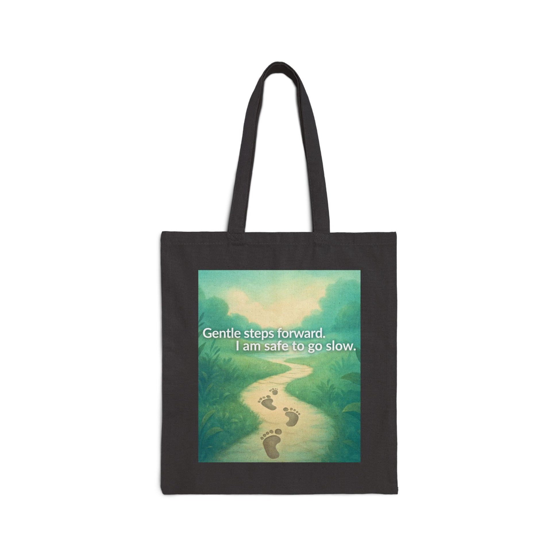 Black tote bag with a nature-themed design and text on a white background