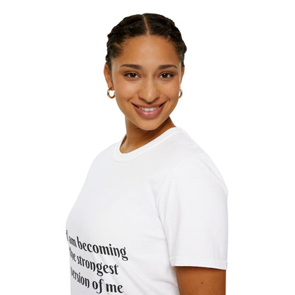 I am becoming the strongest version of me. — Unisex Softstyle T‑Shirt