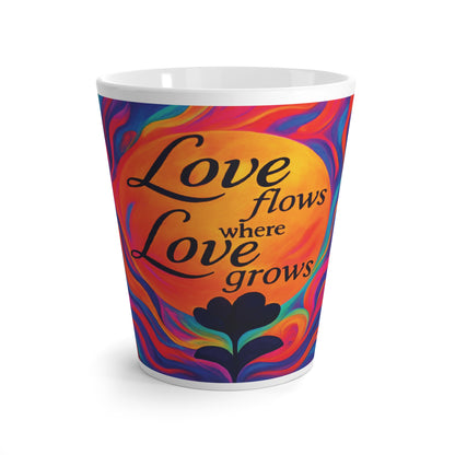 Colorful cup with 'Love flows where Love grows' text on a white background