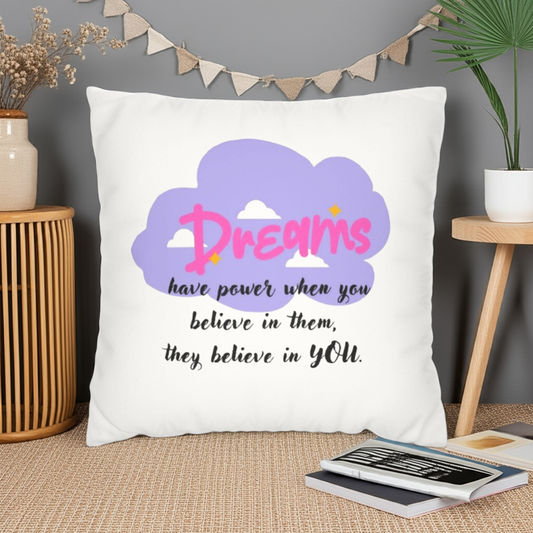 White pillow with purple cloud design and motivational quote on a white background BELIEVE IN YOUR DREAMS