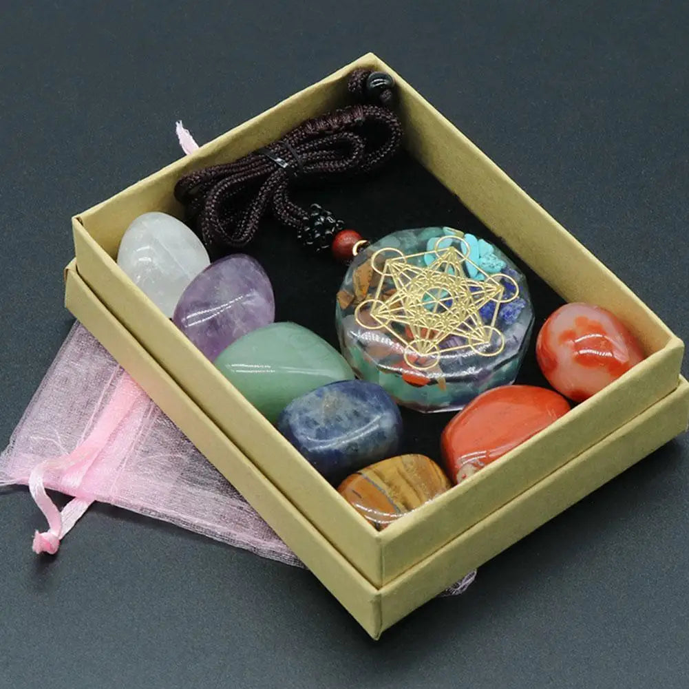 Box containing various colorful stones and a necklace on a dark background Natural 7 Chakra Crystal Healing Necklace Set for Meditation Reiki and Energy Balance