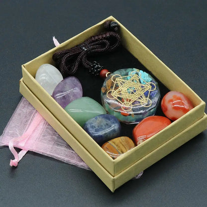 Box containing various colorful stones and a necklace on a dark background Natural 7 Chakra Crystal Healing Necklace Set for Meditation Reiki and Energy Balance
