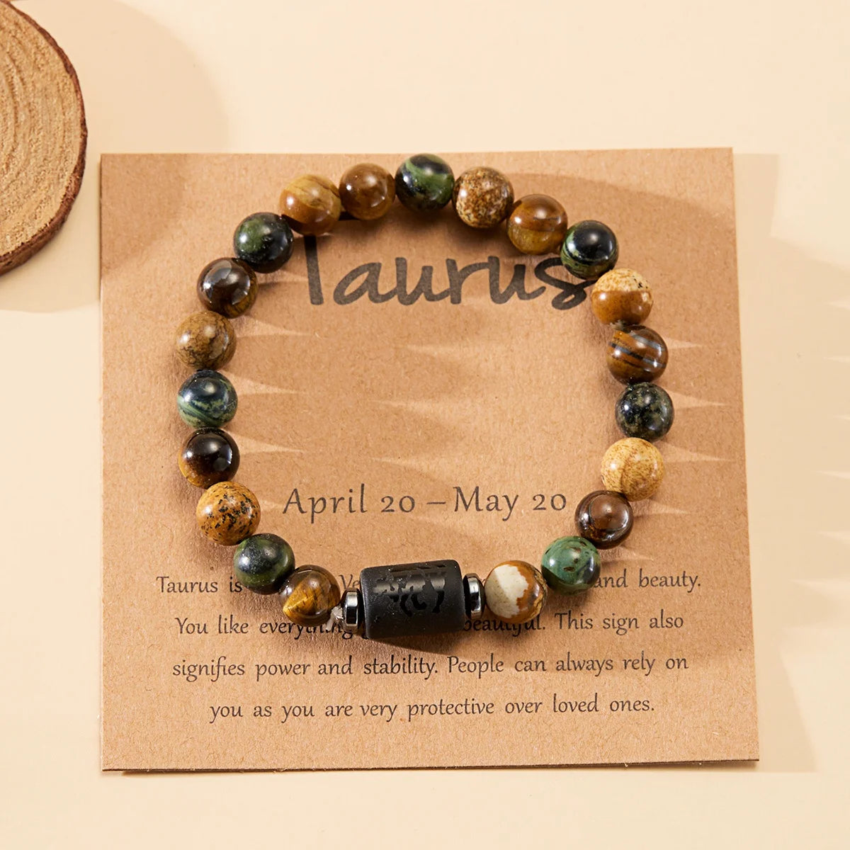 Beaded bracelet on a Taurus card with astrological information