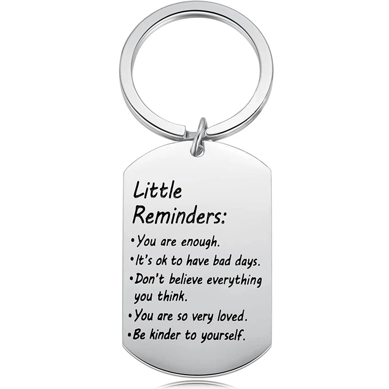 Stainless steel keychain with motivational message on a white background