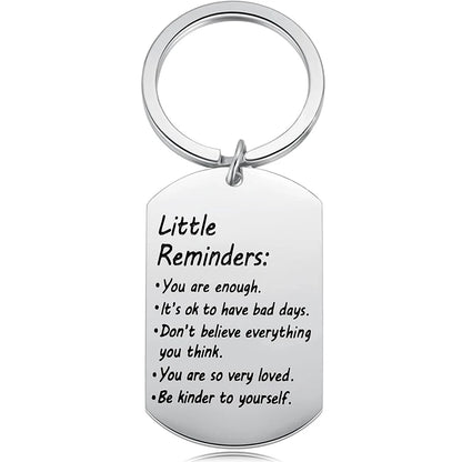 Stainless steel keychain with motivational message on a white background