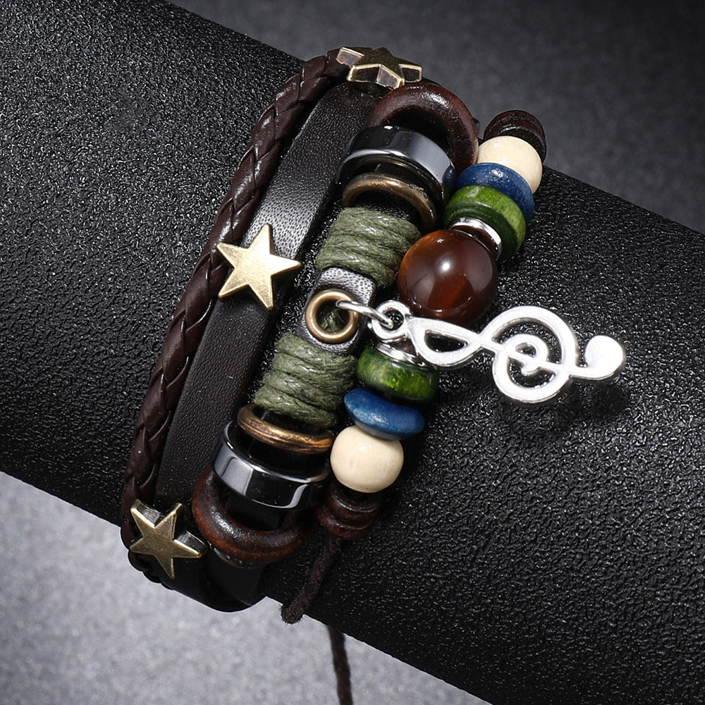 Multicolored beaded bracelet with star and infinity charm on a dark surface